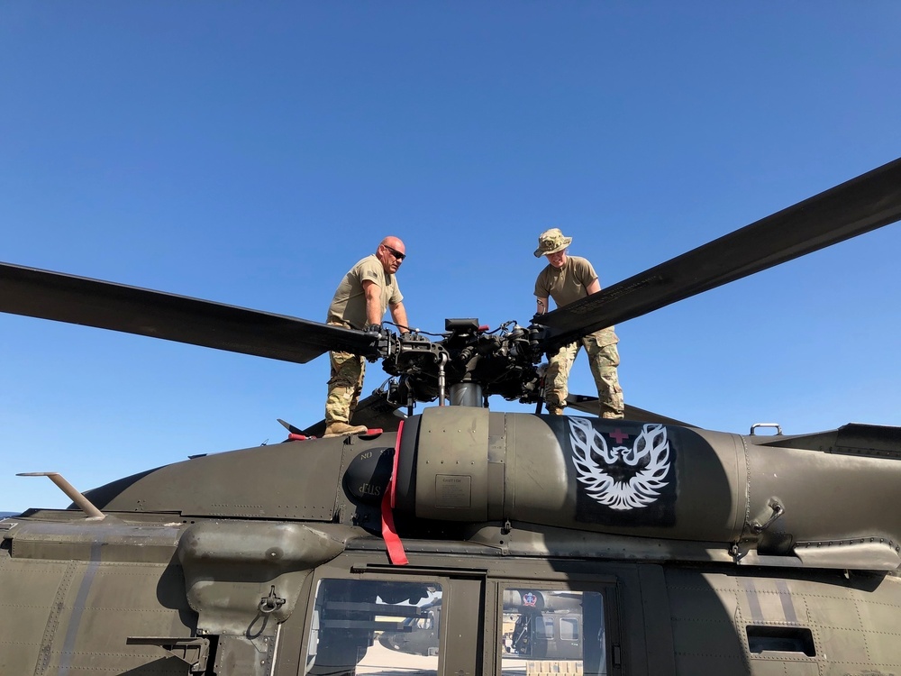 Soldiers working on working on rotor section