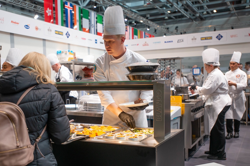 Staff Sgt. Justin Chase serves the paying attendees of the IKA Culinary Olympics