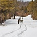 Fort McCoy Cold-Weather Operations Course Class 20-03 students practice snowshoeing, ahkio sled use