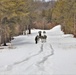 Fort McCoy Cold-Weather Operations Course Class 20-03 students practice snowshoeing, ahkio sled use