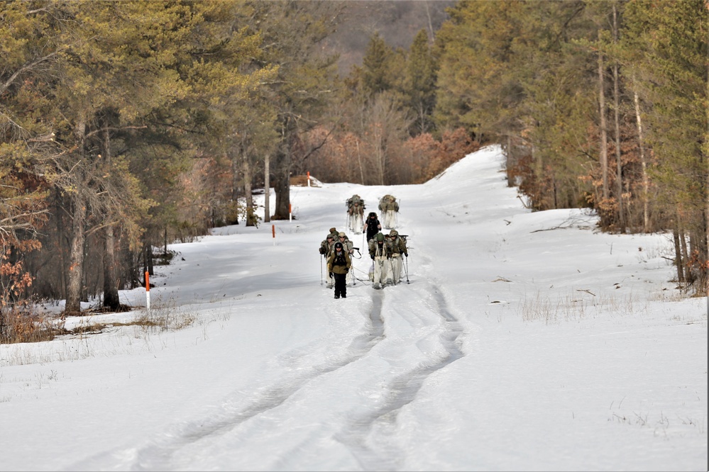 Fort McCoy Cold-Weather Operations Course Class 20-03 students practice snowshoeing, ahkio sled use