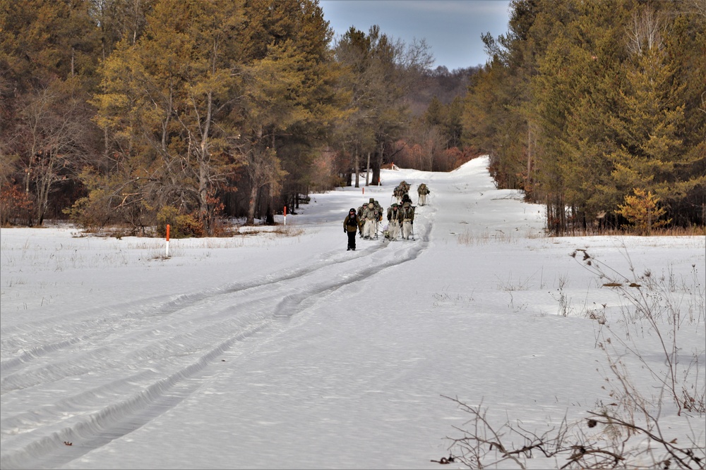 Fort McCoy Cold-Weather Operations Course Class 20-03 students practice snowshoeing, ahkio sled use