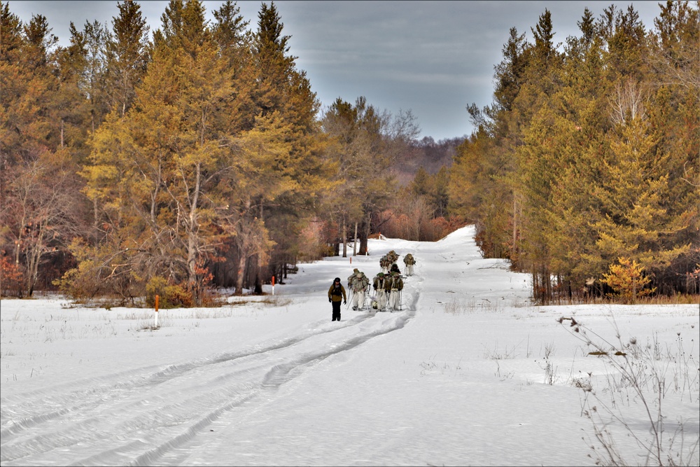 Fort McCoy Cold-Weather Operations Course Class 20-03 students practice snowshoeing, ahkio sled use
