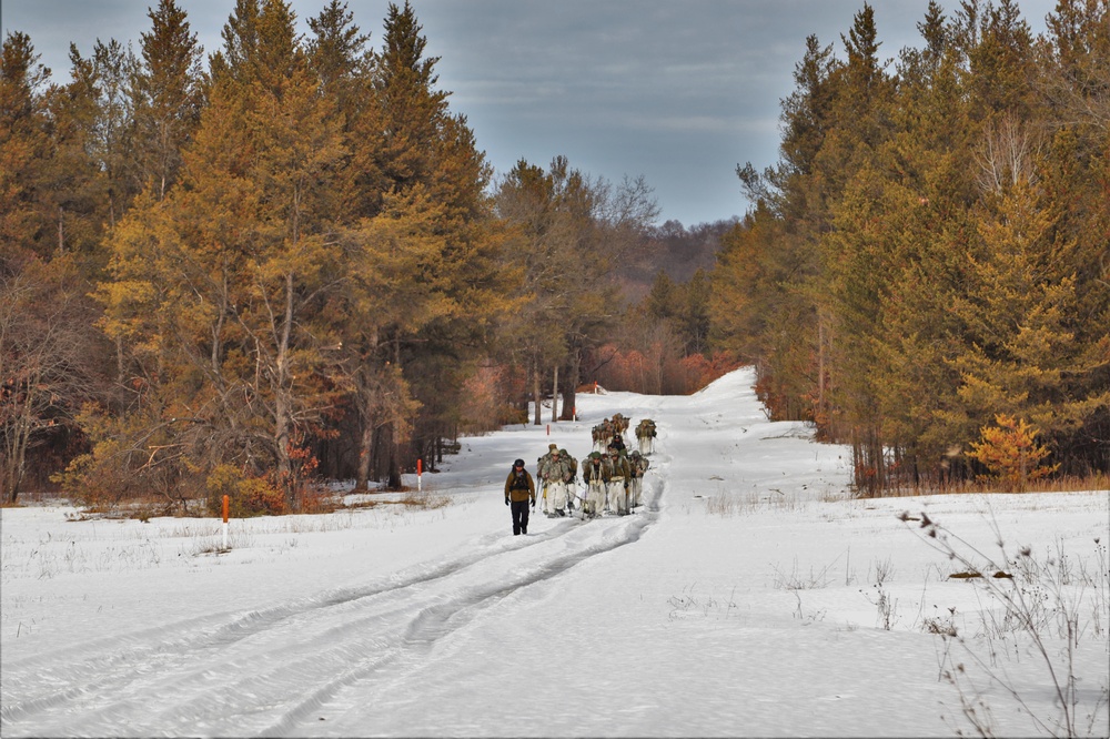 Fort McCoy Cold-Weather Operations Course Class 20-03 students practice snowshoeing, ahkio sled use