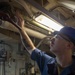 GHWB Sailor Cleans Corrosion