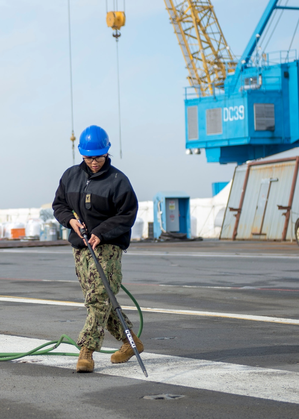 GHWB Sailor Cleans Flight Deck