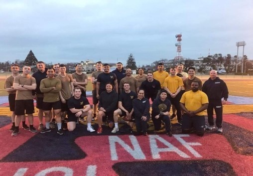U.S. Navy Seabees with NMCB-5's Detail Atsugi and Public Works Department Atsugi play football