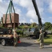 U.S. Navy Seabees with NMCB-5 replace a generator with 18th Civil Engineer Squadron