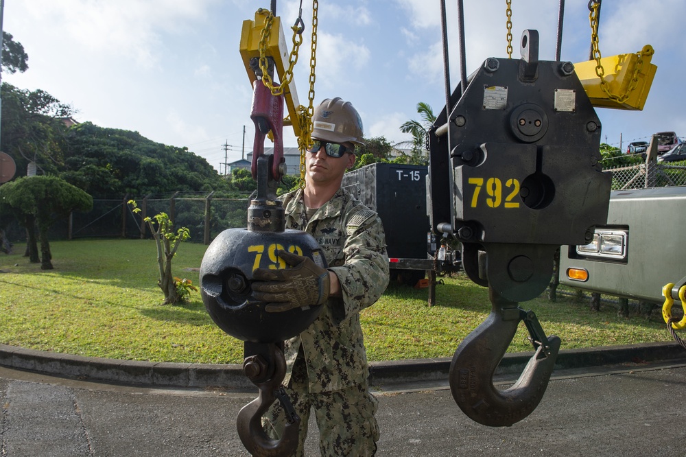 U.S. Navy Seabees with NMCB-5 replace a generator with 18th Civil Engineer Squadron