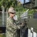 U.S. Navy Seabees with NMCB-5 replace a generator with 18th Civil Engineer Squadron