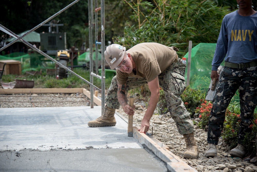 U.S. Navy Seabees deployed with NMCB-5’s Detail Palawan continue construction on Malatgao Elementary School