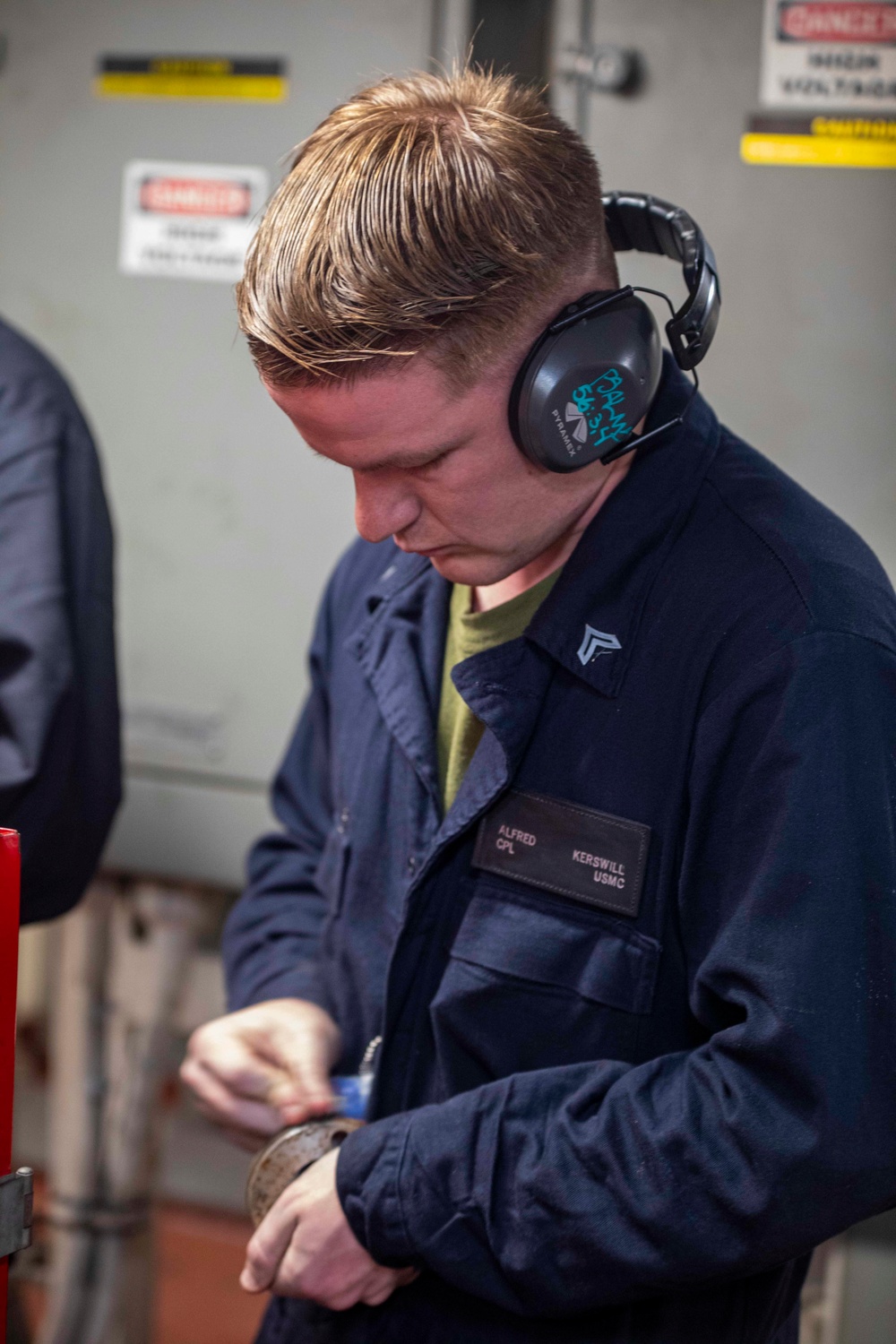 Sailors repair an RO HP pump