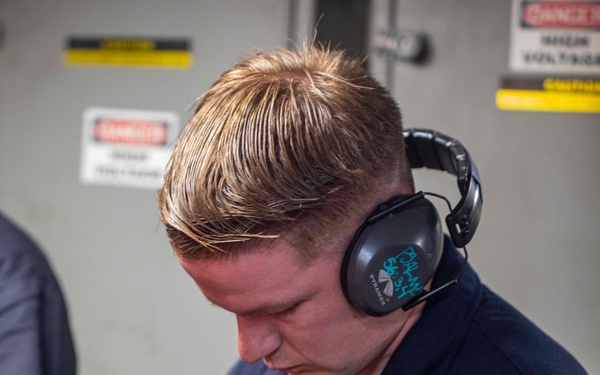 Sailors repair an RO HP pump