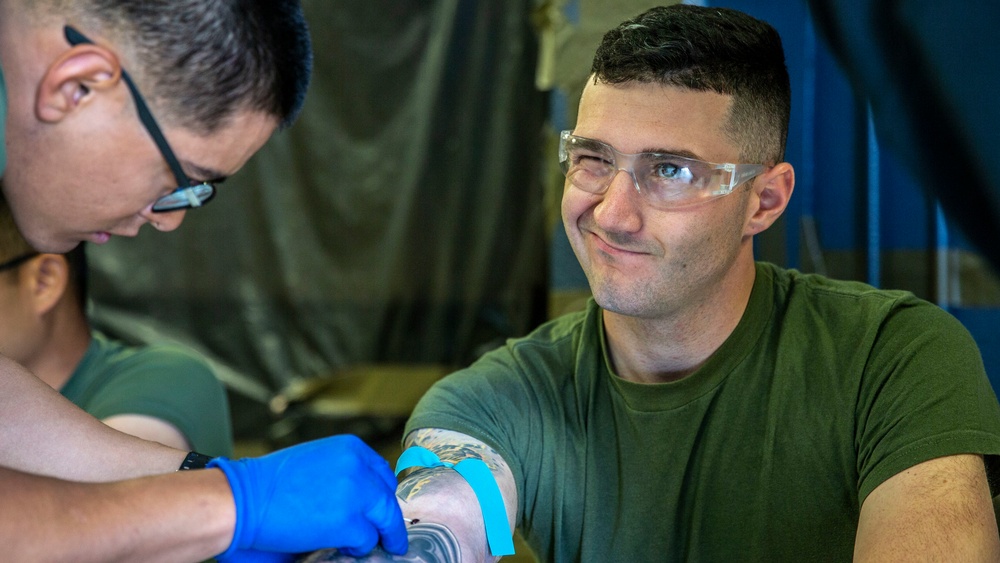 Field Medical Training Battalion practices intravenous needle administration