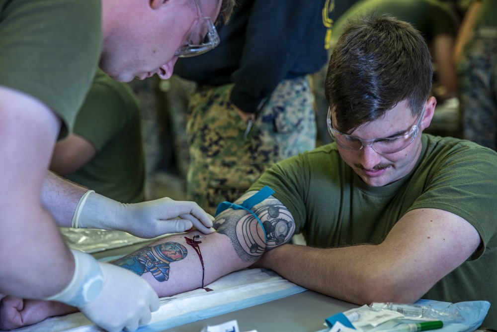 Field Medical Training Battalion practices intravenous needle administration