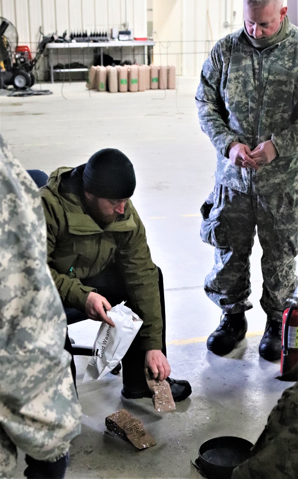 Cold-Weather Operations Course Class 20-03 students learn about equipment during training at Fort McCoy