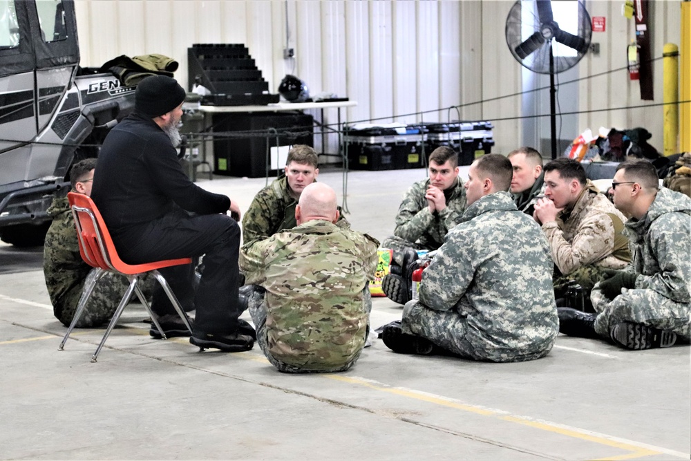 Cold-Weather Operations Course Class 20-03 students learn about equipment during training at Fort McCoy