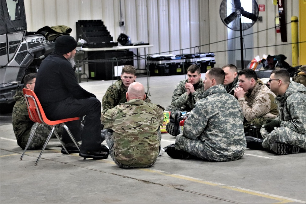 Cold-Weather Operations Course Class 20-03 students learn about equipment during training at Fort McCoy