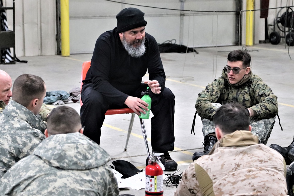 Cold-Weather Operations Course Class 20-03 students learn about equipment during training at Fort McCoy