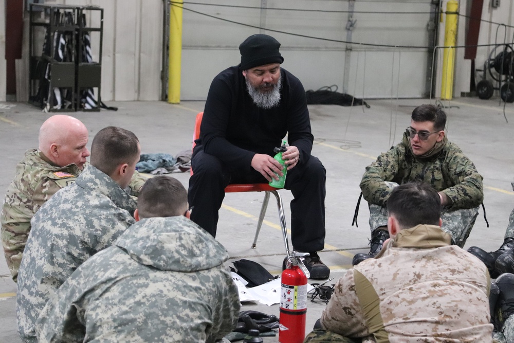 Cold-Weather Operations Course Class 20-03 students learn about equipment during training at Fort McCoy