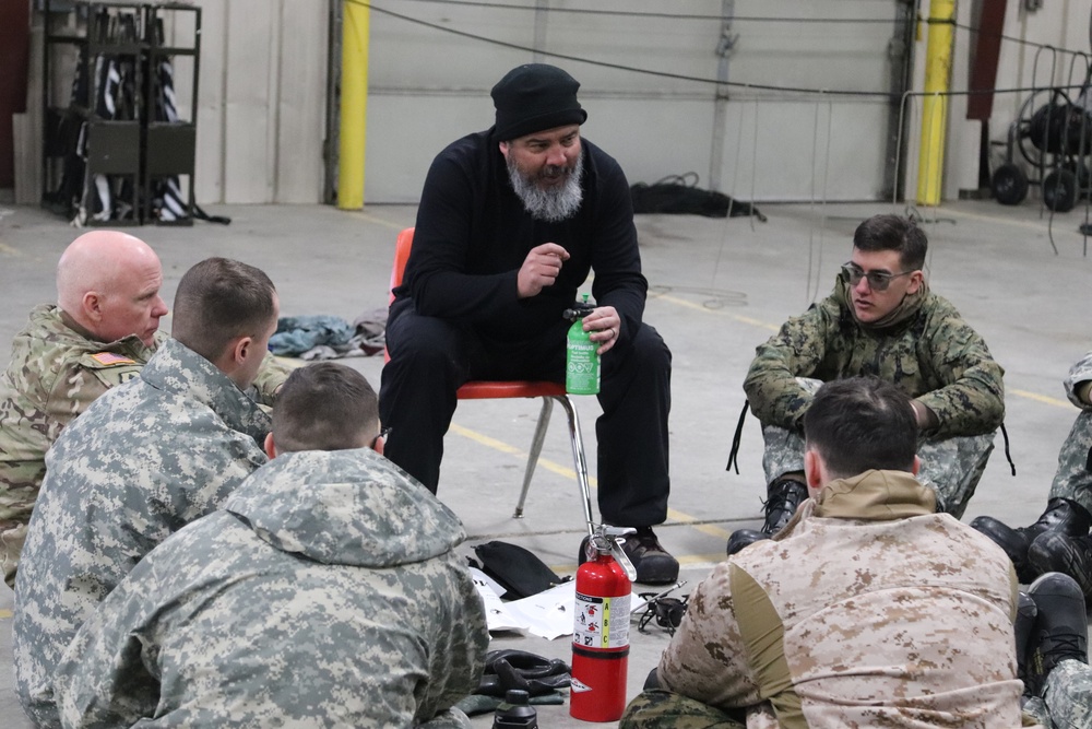 Cold-Weather Operations Course Class 20-03 students learn about equipment during training at Fort McCoy