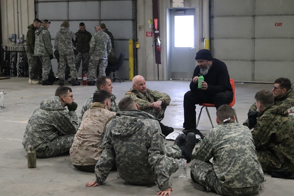 Cold-Weather Operations Course Class 20-03 students learn about equipment during training at Fort McCoy