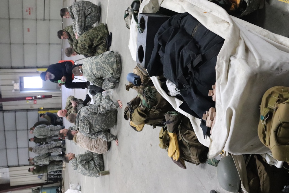 Cold-Weather Operations Course Class 20-03 students learn about equipment during training at Fort McCoy