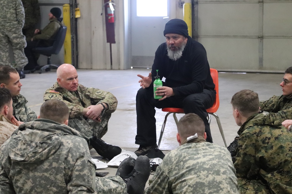 Cold-Weather Operations Course Class 20-03 students learn about equipment during training at Fort McCoy