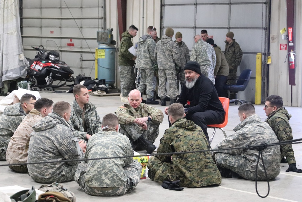 Cold-Weather Operations Course Class 20-03 students learn about equipment during training at Fort McCoy