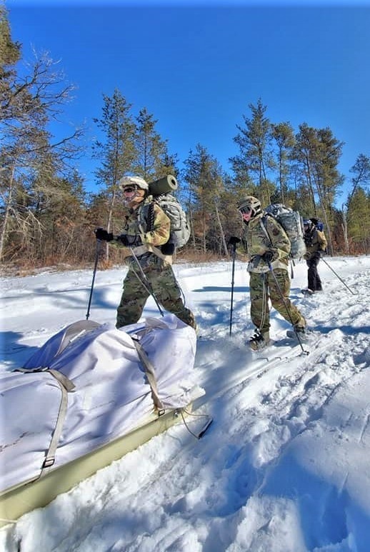 Fort McCoy Cold-Weather Operations Course Class 20-04 students practice snowshoeing, ahkio sled use at Fort McCoy