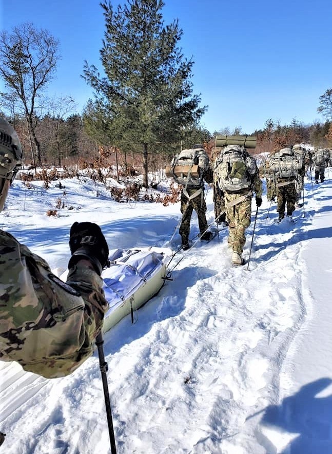 Fort McCoy Cold-Weather Operations Course Class 20-04 students practice snowshoeing, ahkio sled use at Fort McCoy