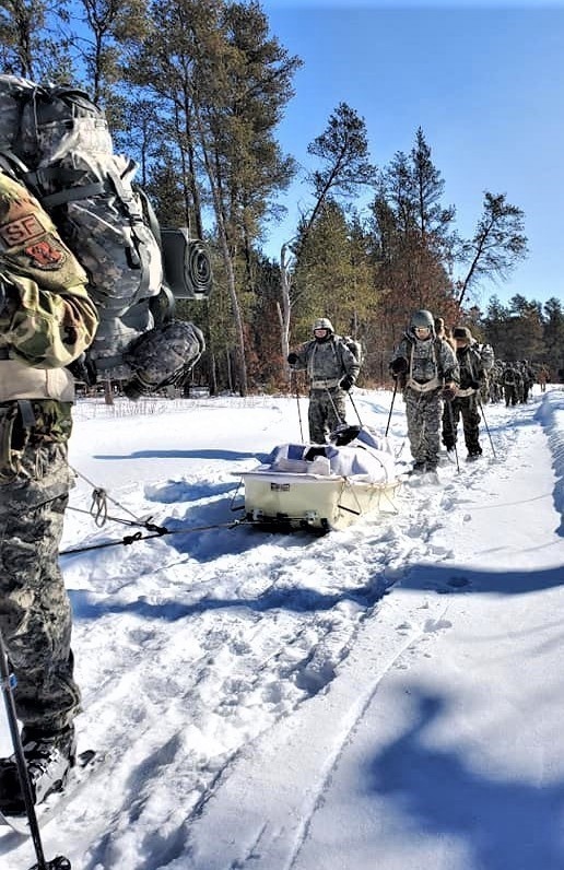 Fort McCoy Cold-Weather Operations Course Class 20-04 students practice snowshoeing, ahkio sled use at Fort McCoy
