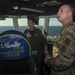 Military Personnel Observe Flight Operations