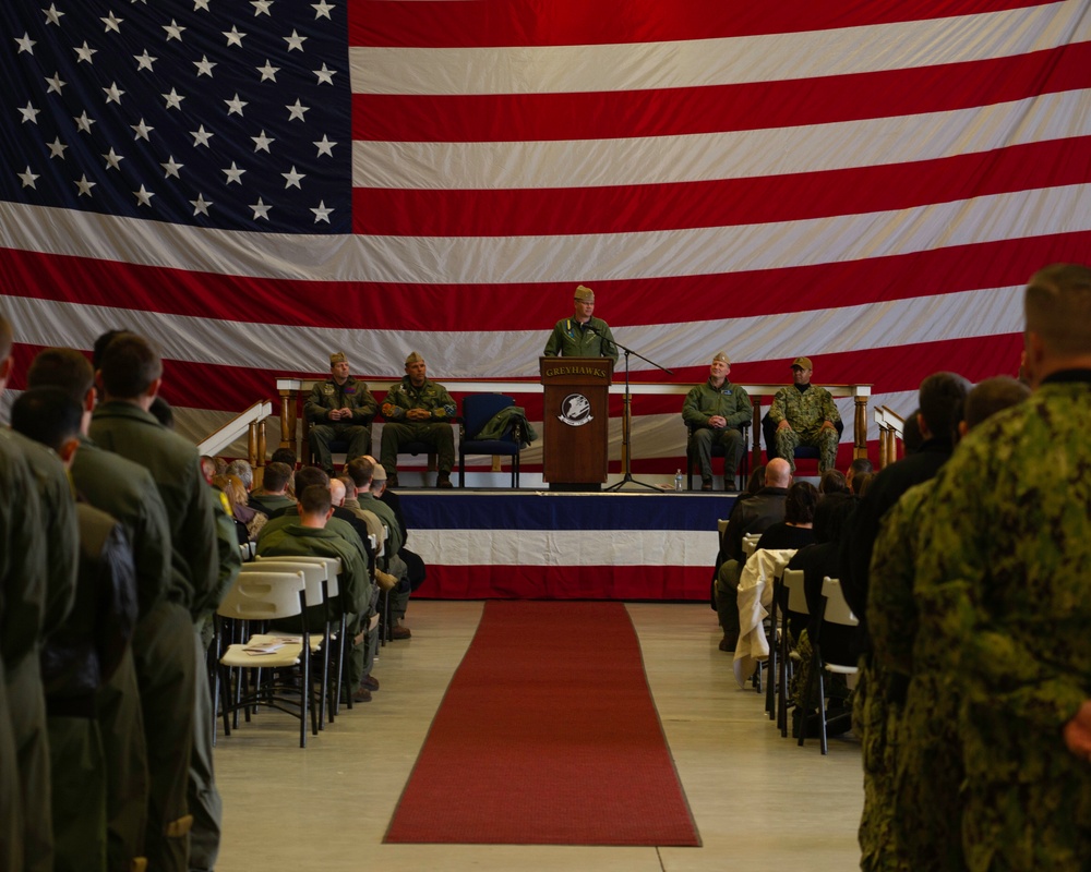 Commadore delivers remarks during change of command ceremony