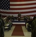 Commadore delivers remarks during change of command ceremony