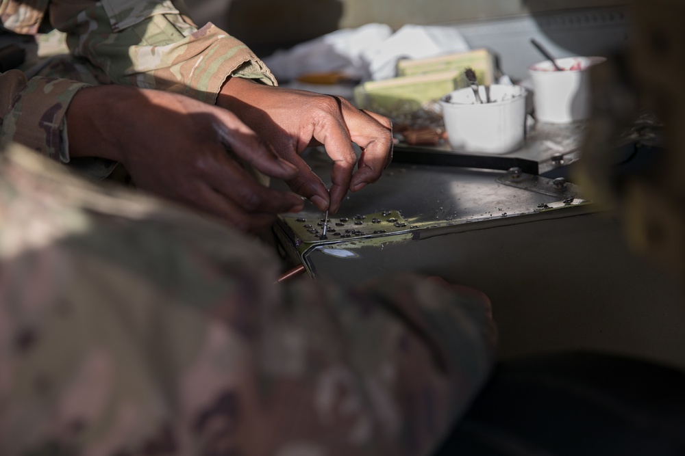 Soldiers Patch a CH-47 Chinook