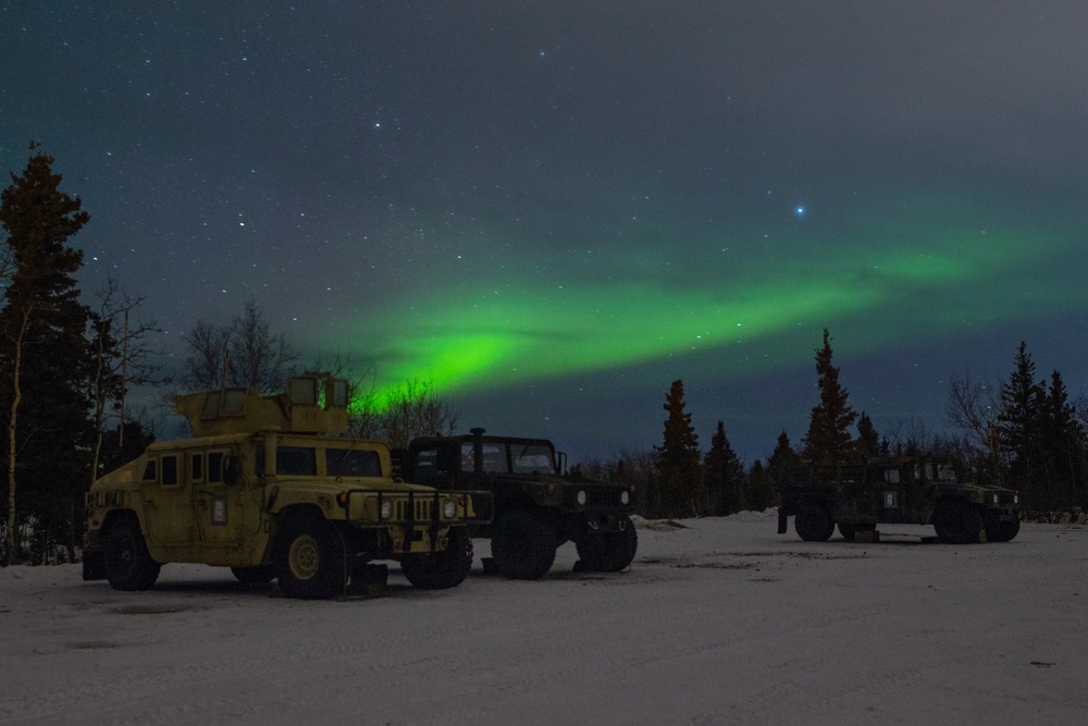 SPMAGTF-AE: Aurora Borealis over 2nd LAAD Humvees