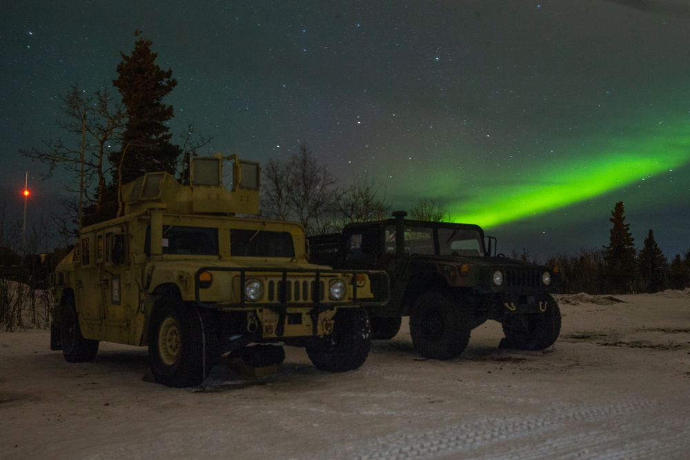 SPMAGTF-AE: Aurora Borealis over 2nd LAAD Humvees