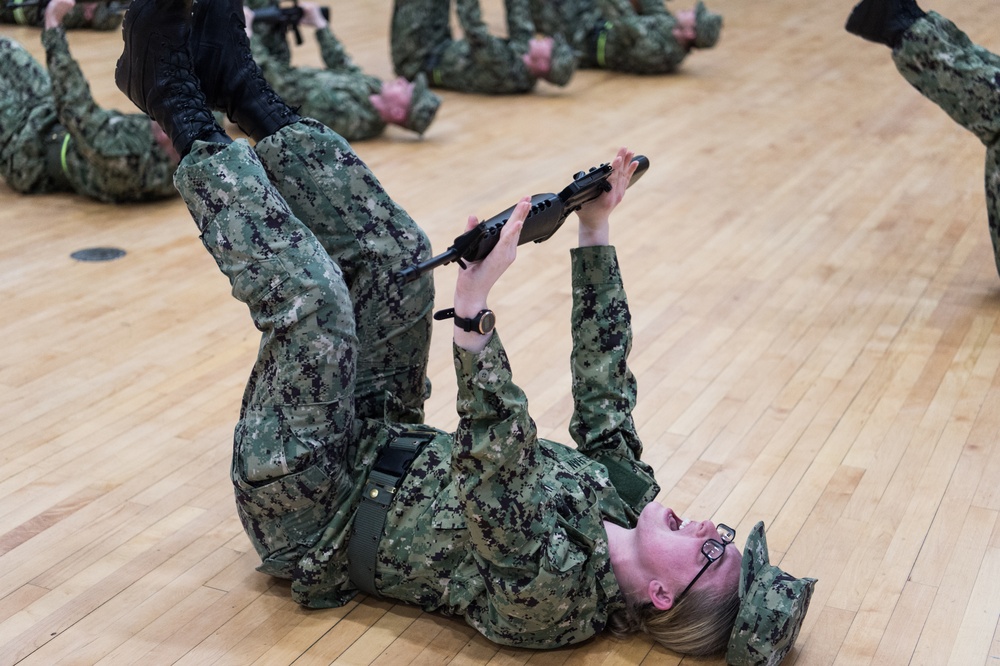 200221-N-TE695-0025 NEWPORT, R.I. (Feb. 20, 2020) -- Navy Officer Candidate School students perform remedial physical training