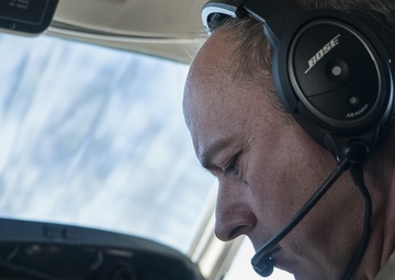 U.S. Army CWO4 Matthew Crump, pilot for Bravo Company of the 228th Aviation Regiment, reads the mid flight checklist for the C-12 Huron