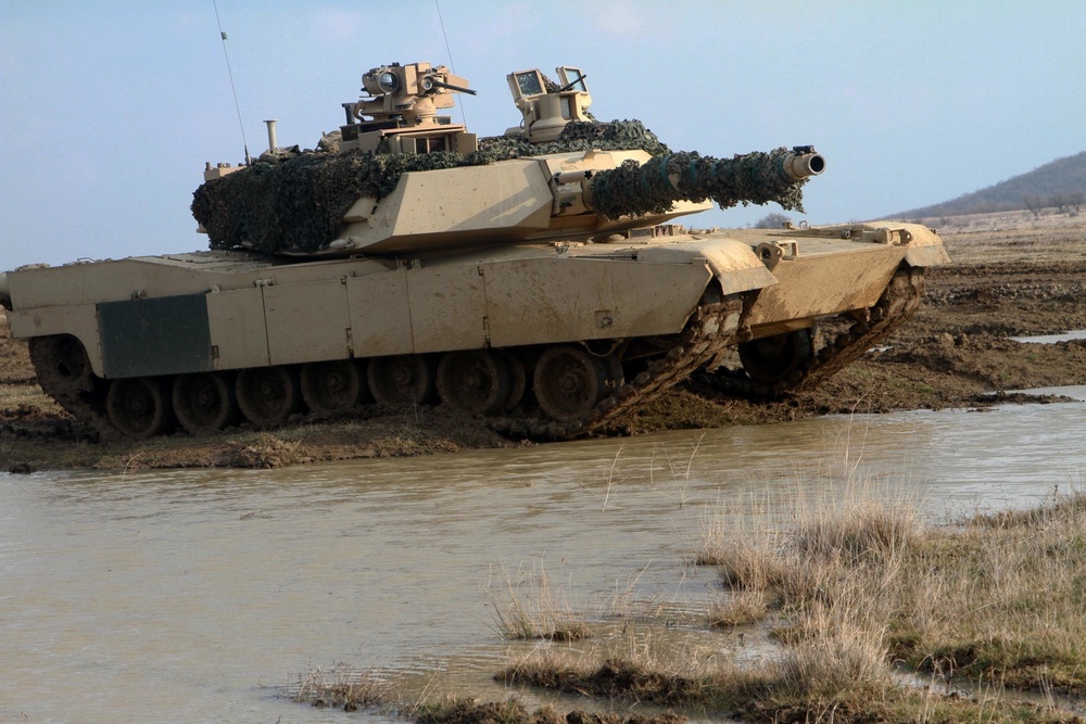 Soldiers in a M1A2 Abrams tank conduct a dry rehearsal 