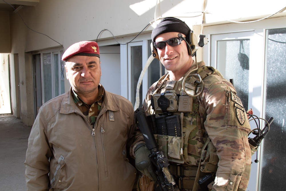 Sgt. 1st Class Joseph Duehning stands with a Peshmerga soldier