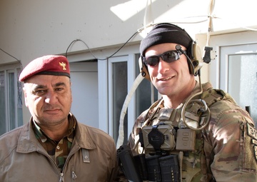 Sgt. 1st Class Joseph Duehning stands with a Peshmerga soldier