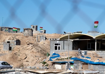Kurdish flags are seen flying at a Peshmerga outpost