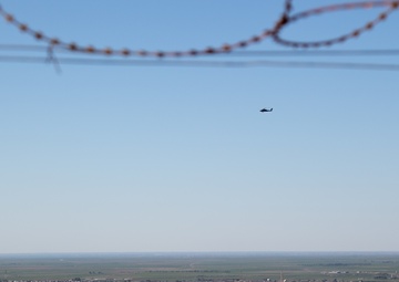 A U.S. Army AH-64 Apache scans the area for ISIS militants