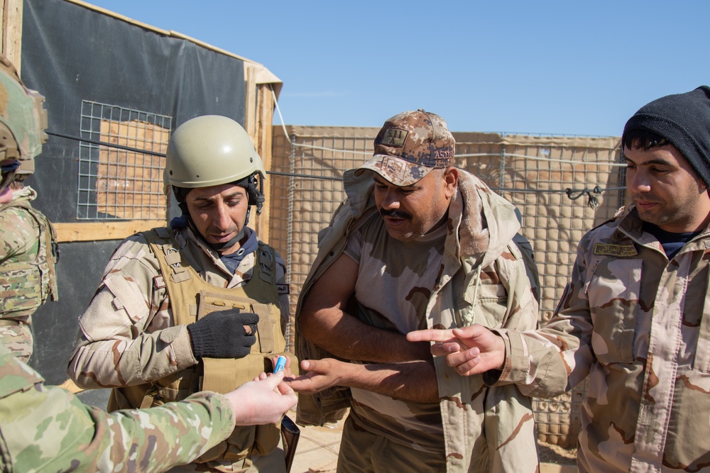U.S. Soldiers share medical supplies with Iraq Army soldiers