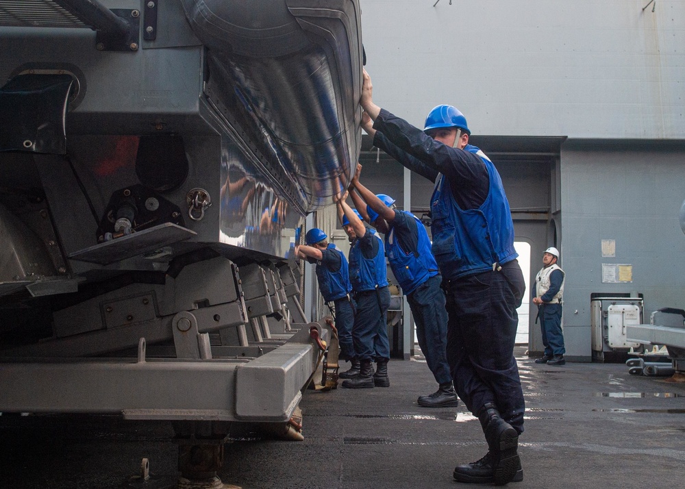 USS Green Bay (LPD 20) Sailors lower a RHIB