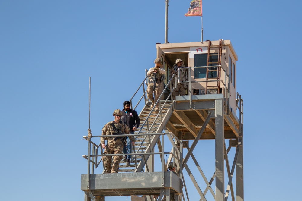 U.S. Soldiers inspect a guard tower along the perimeter of Al Asad Airbase