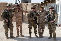 25th Infantry Division Soldiers take a photo with Iraqi troops