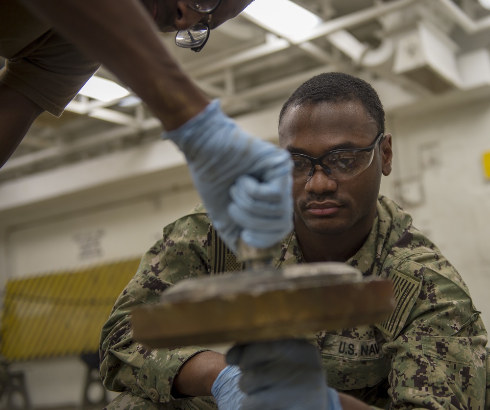 GHWB Sailors Lubricate Sprinkler System